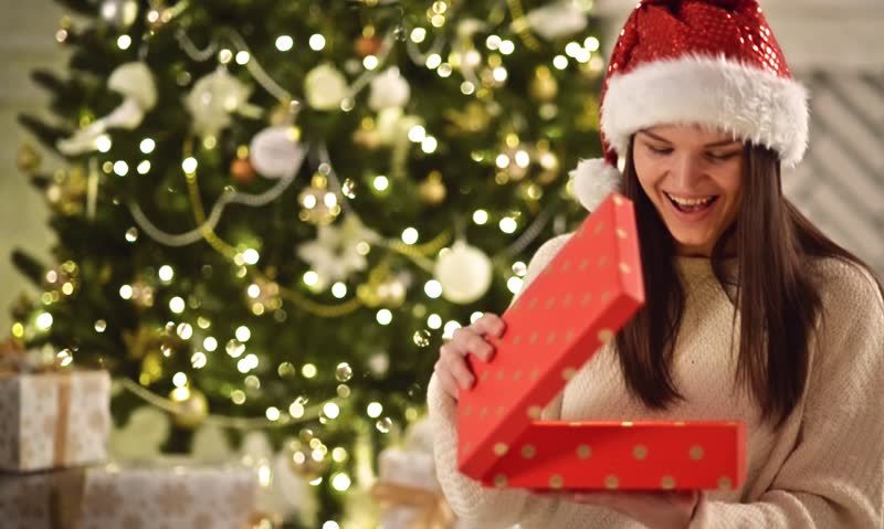 woman opening a christmas gift