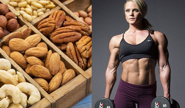 bodybuilding woman standing next to a picture of nuts 